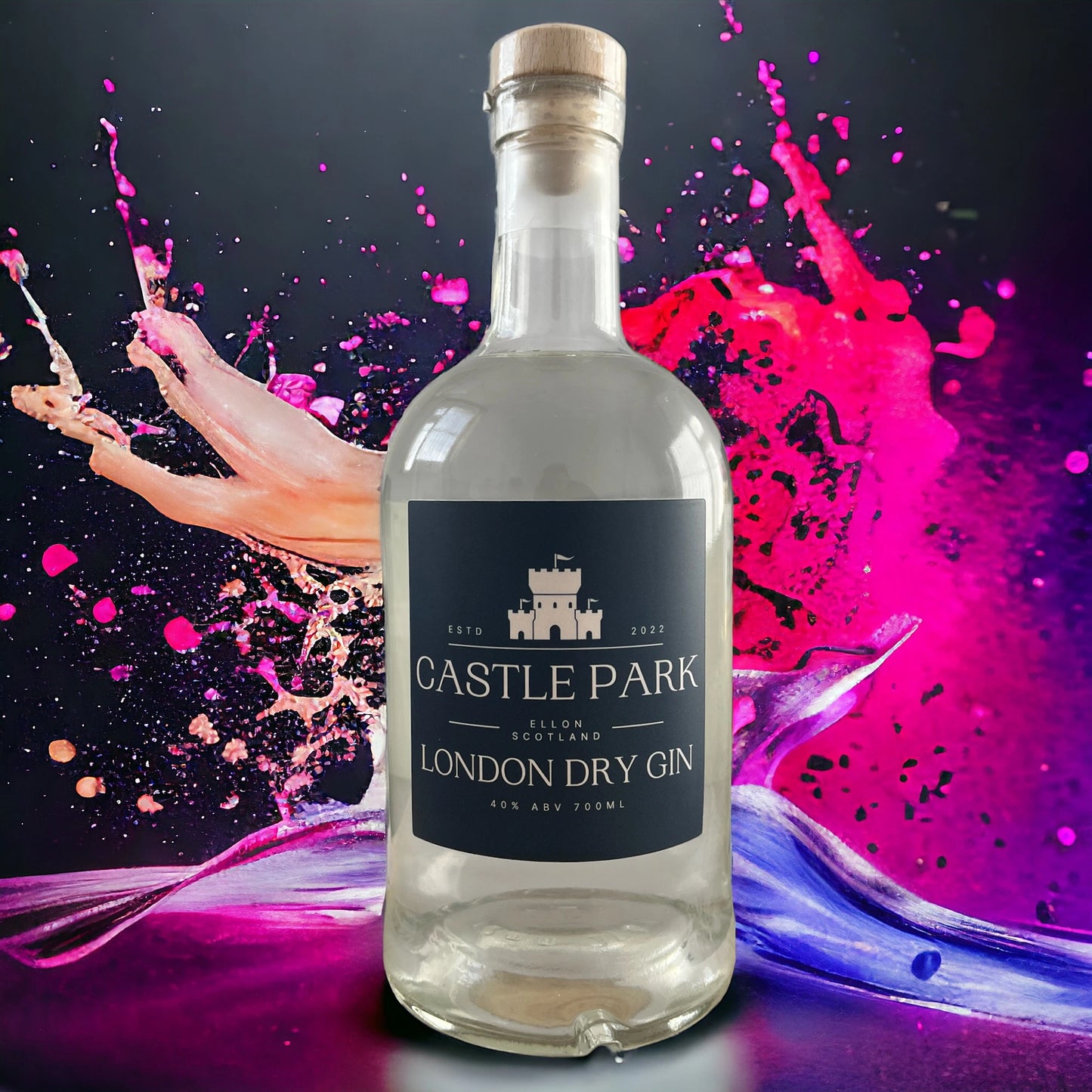 Castle Park London Dry Gin bottle from Ellon, Scotland, displayed against a vibrant splash of pink and purple paint — premium Scottish craft gin with bold modern design.