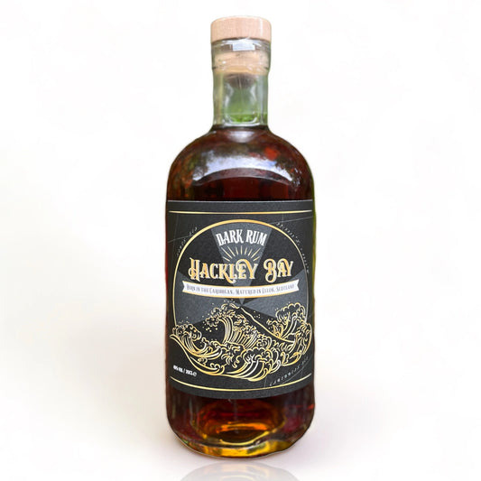 Bottle of Hackley Bay Dark Rum on a white background