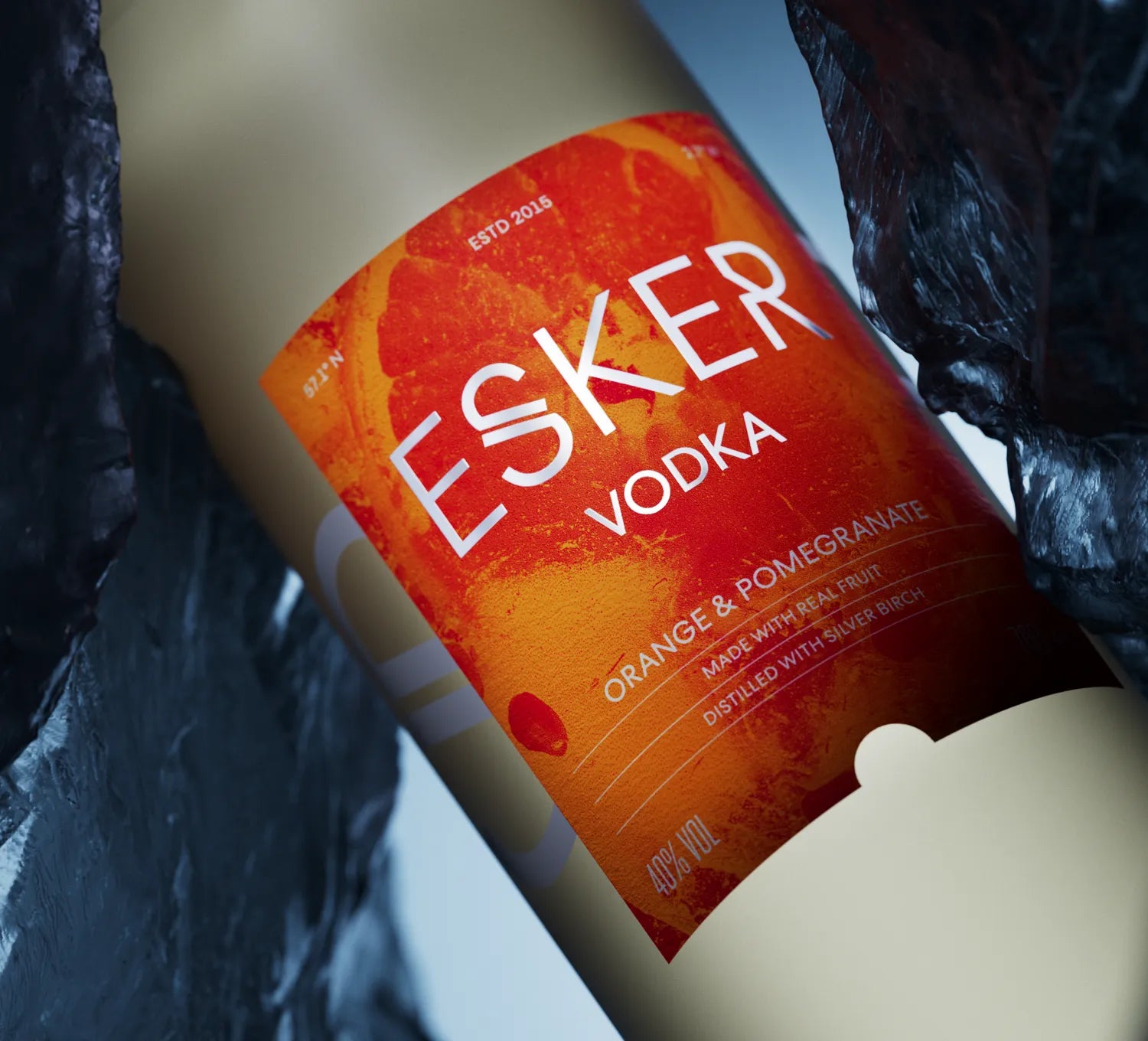 Close-up of Esker Orange & Pomegranate Vodka label – vibrant citrus bottle design