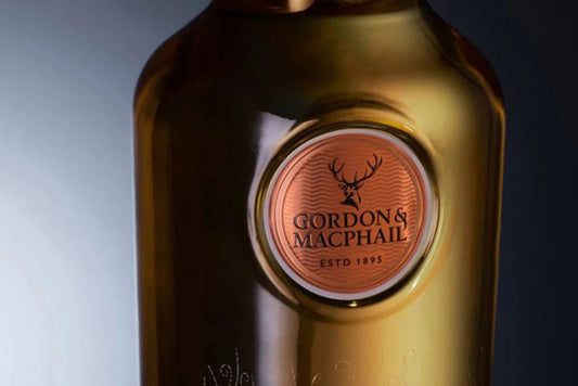 Bottle of Gordon & MacPhail whisky with a label on a dark background